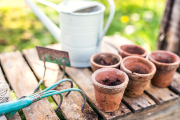 Garden tools and flower pots in the garden.