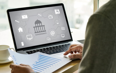 GOVERNANCE and building, Authority Computing Computer Laptop with screen on table Silhouette and...