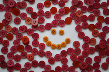 Smiley face red and yellow in buttons, background