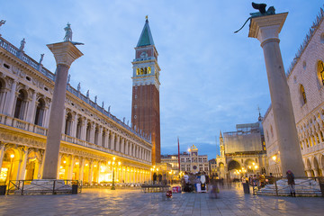 Fototapeta premium Romantic night view of San Marco square during sunset blue hour with its famous Campanile and Doge palace or Palazzo Ducale