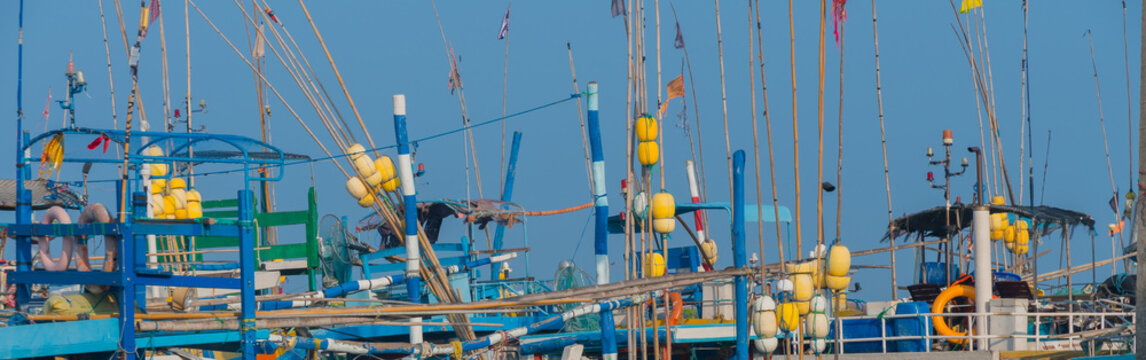 masts fishing rods and floats on boats fishermen