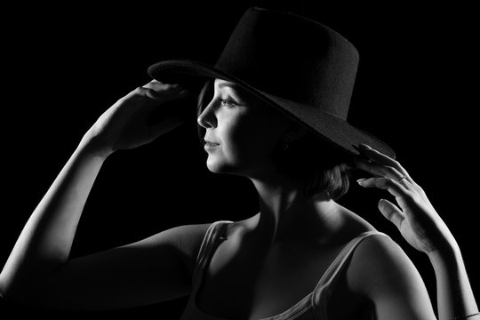 Young woman in a black hat