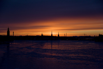 Civil twilight, the brightest of the twilight phase over Old Town in Stockholm a cold winter day with a icy lake Malaren