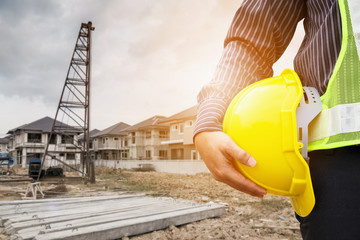 Asian business man construction engineer worker at house building site