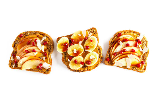 Peanut butter sandwiches with apple, banana and pomegranate on white background. Food white background, copy space, top view, isolate