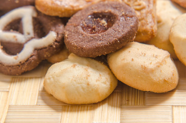 assorted cookies on wooden tray