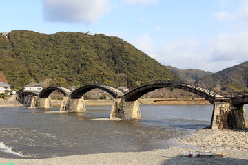 On the way to the iconic Kintai Bridge made of wood. On top of the hill is the Iwakuni Castle