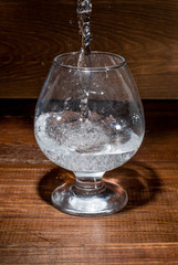 the water is poured into a glass