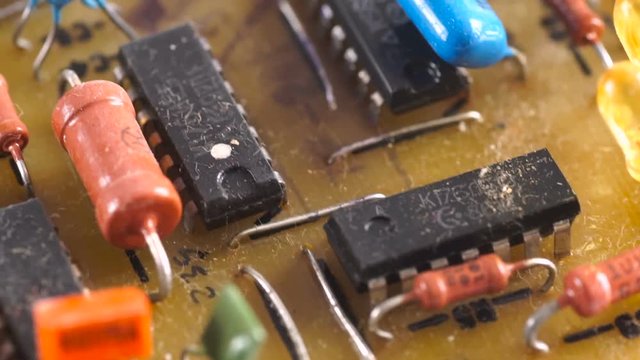 Old electronic board with chips on a macro shot.