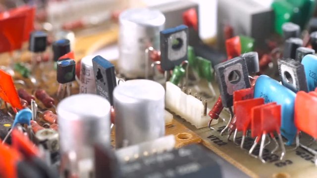 Old electronic board with chips on a macro shot.