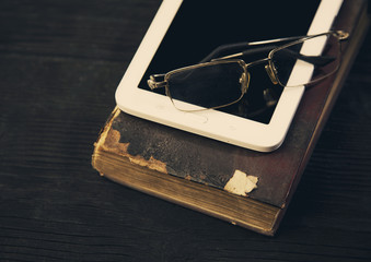 Part old book tablet and eyeglasses  photo