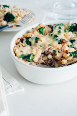 Casserole with pasta, meat, broccoli and Bechamel sauce under a cheese crust.
