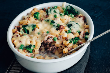 Baked pasta with broccoli, cauliflower, cheese and bechamel sauce.