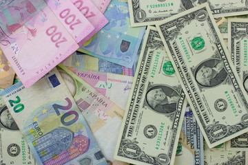 Fototapeta na wymiar American dollar and Euro banknotes. Background with money