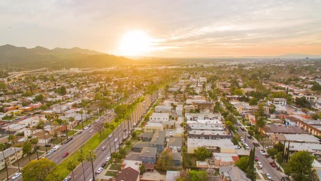 Aerial timelapse in motion (hyperlapse) of the cinematic sunset in suburban area of Los Angeles