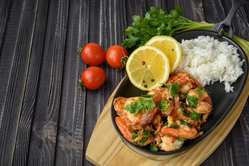 Roasted shrimps with lemon, garlic,herbs and white rise, seafood shelfish shrimps prawns grilled with spices