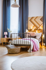 Iron bed in modern bedroom