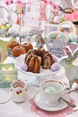 festive table decoration with traditional easter pastries and confectionery