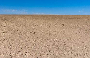 Early spring agricultural landscape with soil prepared for crops sowing near Dnepr city, Ukraine