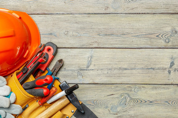 Assorted work tools on wooden table