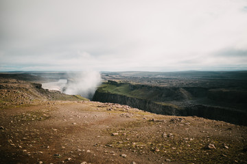 beautiful scenic landscape with rocks and Dettifoss waterfall in iceland