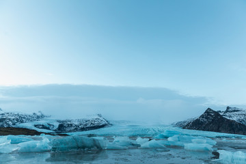beautiful icelandic landscape with melting icebergs in cold water, Iceland, Jokulsarlon lagoon
