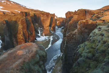 Fototapeta na wymiar majestic landscape with river and rocky hills, fjadrargljufur, iceland