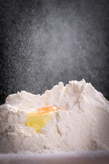 Making dough by female hands at home in kitchen
