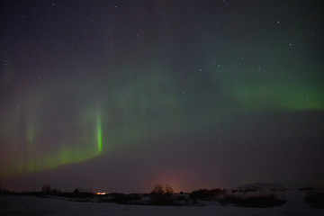 beautiful night sky with magnificent aurora borealis in iceland
