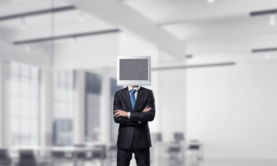 Businessman with monitor instead of head.