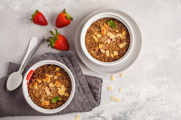 Homemade summer breakfast strawberry crumble. Mini berry cake with strawberry, light background, top view, copy space. Healthy vegan food concept.
