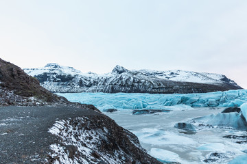 Fototapeta na wymiar beautiful glacial landscape with mountains and icebergs, Svinafellsjokull Glacier, Iceland