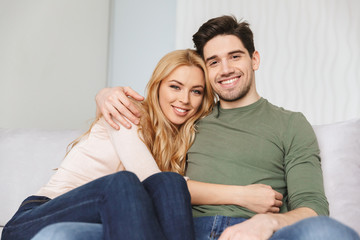 Portrait of a smiling young couple hugging