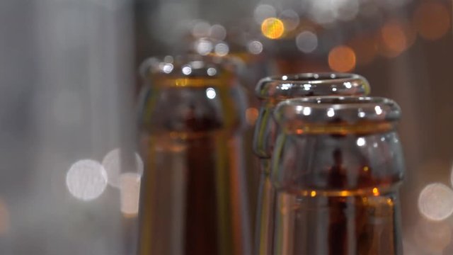 Automatic Beer Bottling Line. Queue of empty bottles on the conveyor.