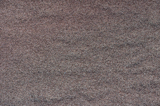 Texture of colored sand by the Baltic Sea