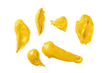 Yellow mustard sauce, spread isolated on white background, top view