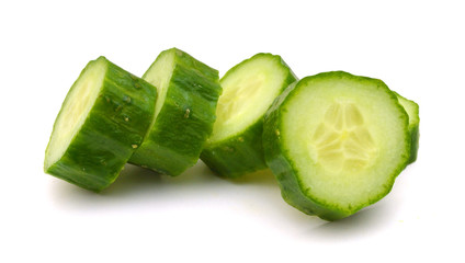 Stack of green cucumber slices  isolated on white