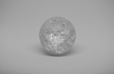 Fototapeta na wymiar Ttansparent ice sphere on a white background