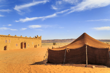 Bedouin tent with clear blue sky above it