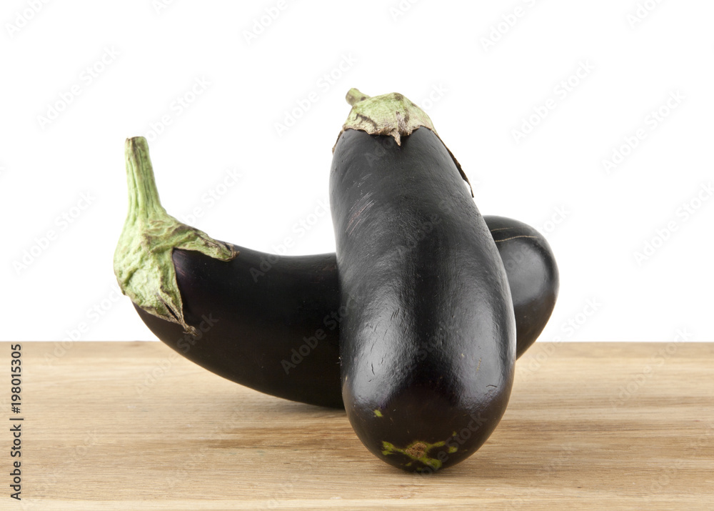 Wall mural eggplant on a cutting board isolated on a white background