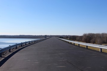 The road across the dam bridge in the park.