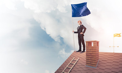 Young businessman with flag presenting concept of leadership. Mi