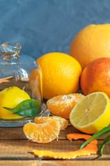Fresh citrus fruits on wooden table.