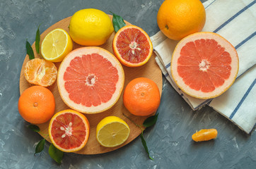 Fresh citrus fruits on table, top view.