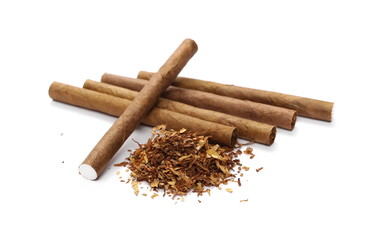 Cigarillos and tobacco pile isolated over white background