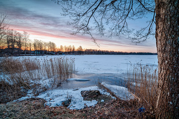 Swedish winter landscape with old boat