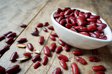 Healthy diet beans. Healthy food with kidney beans in white cup on wooden desk background. Healthy diet food free space used for add messages.