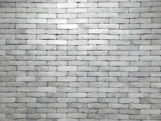 real grey brick wall in blocks with light shining in the center