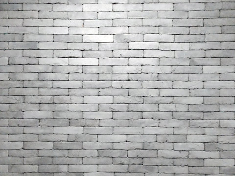 Fototapeta real grey brick wall in blocks with light shining in the center