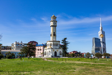 Fototapeta premium BATUMI, GEORGIA - MARCH 17, 2018: A tower in the style of the Ottoman Empire with a clock and a yellow dome. Also known as the Tower of Chacha 